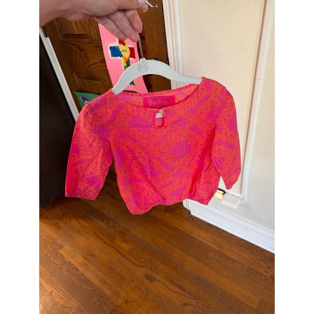 Lilly Pulitzer girl's popover top features a vibrant pink‎ and orange 3